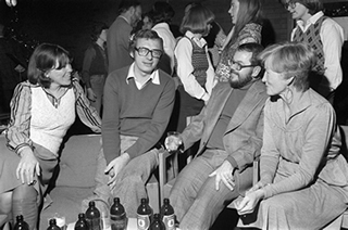 Chatting during a poetry reading in the English Department on November 22, 1977.